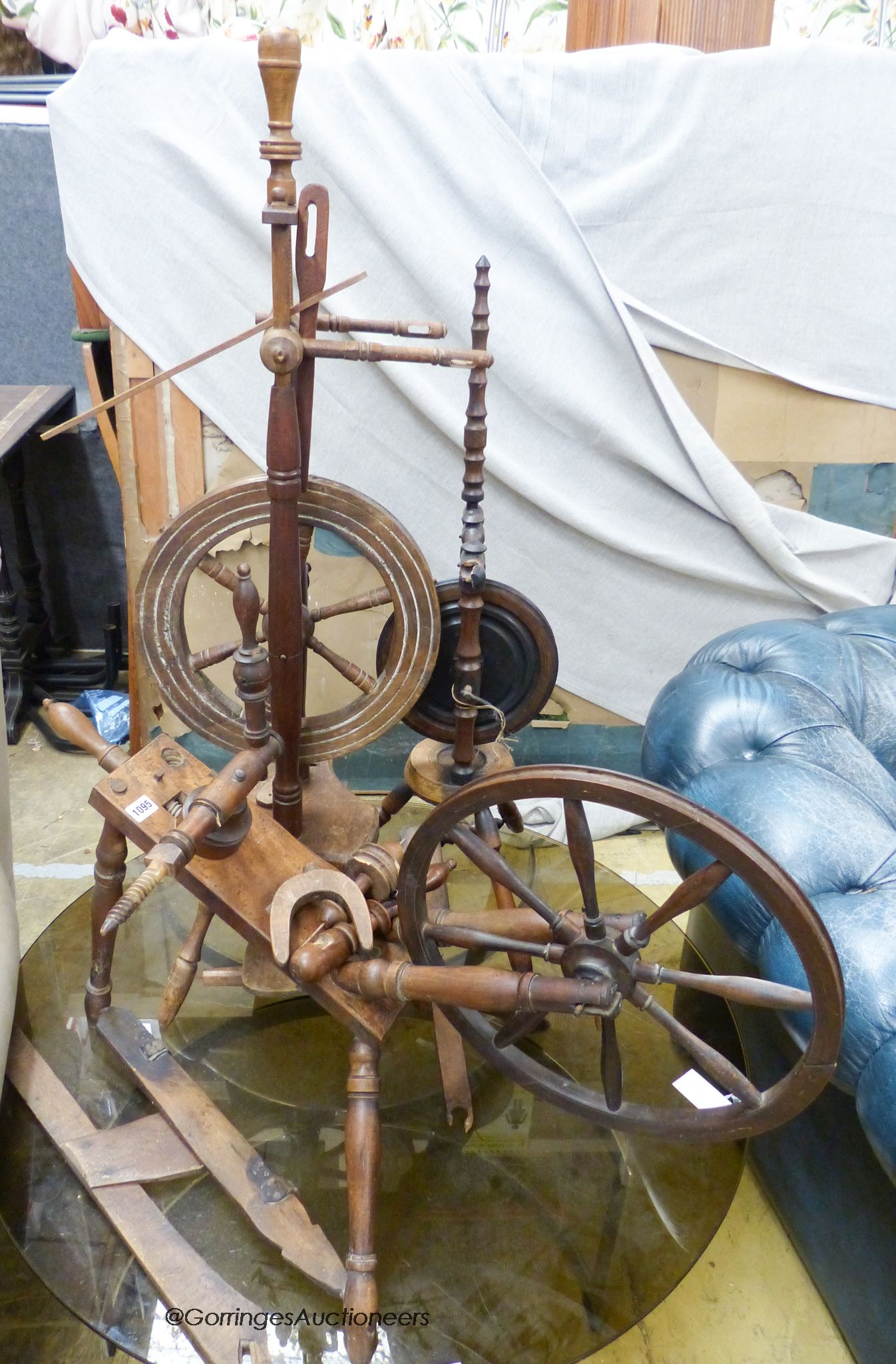 Three 19th century and later spinning wheels. Largest H-114cm